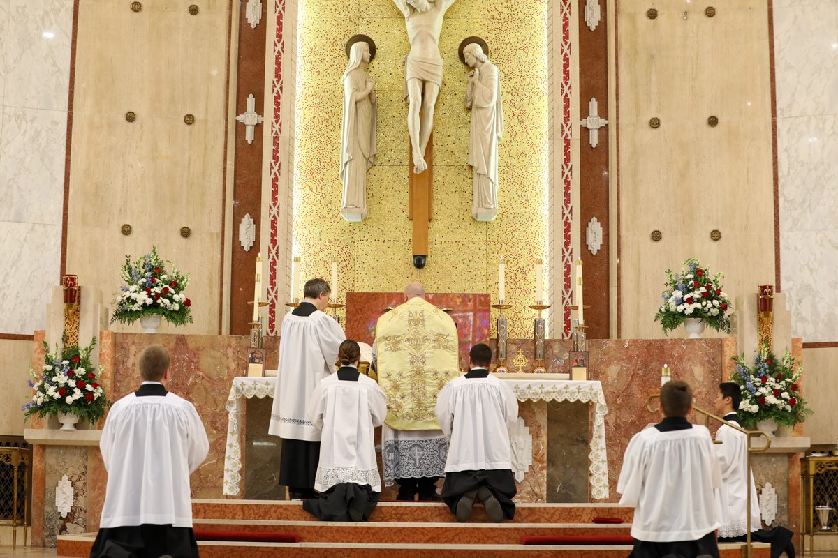At the foot of the altar