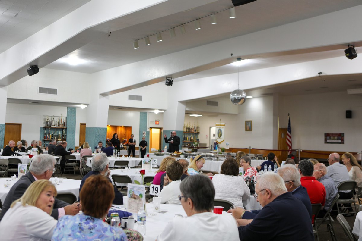 The parish hall full of parishioners at dinner
