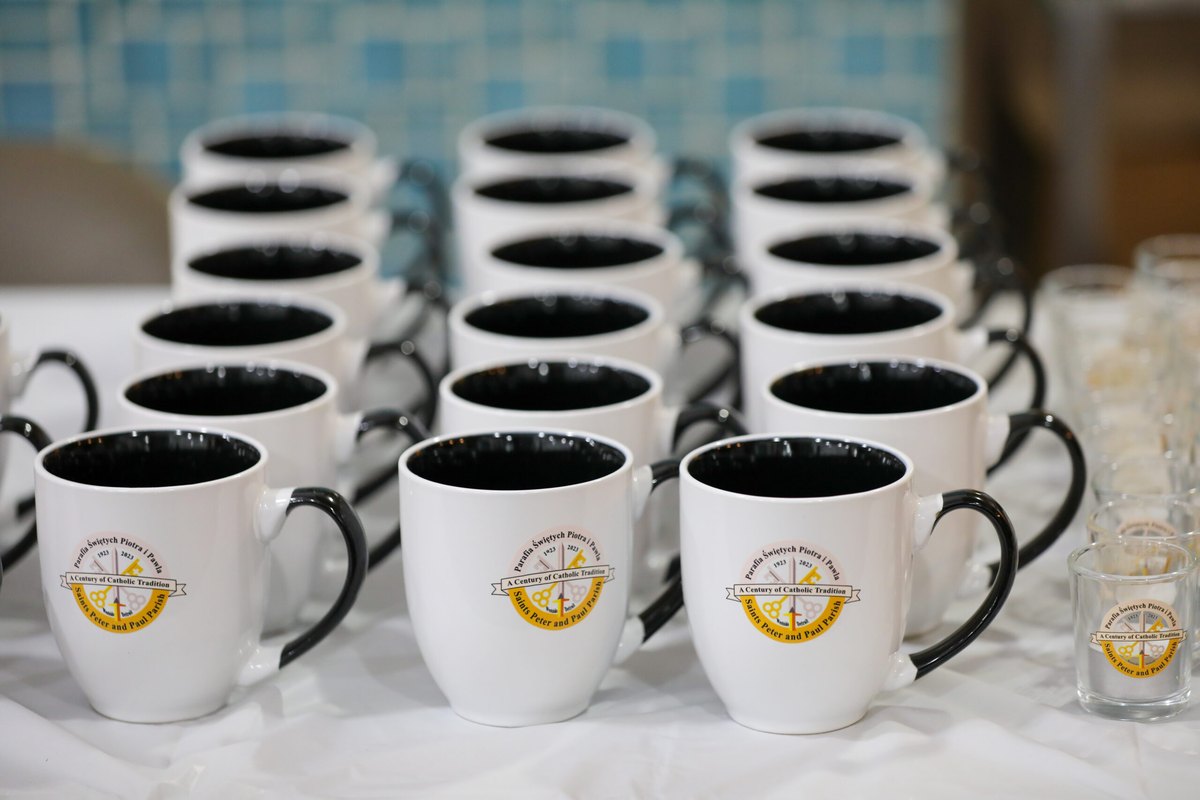 Centennial mugs with the parish's anniversary crest