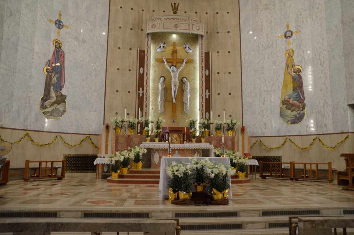 The high altar dressed in lilies for Easter