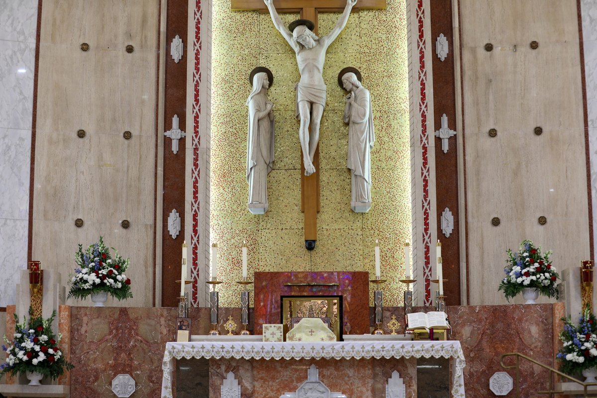 The high altar and gold mosaic crucifix