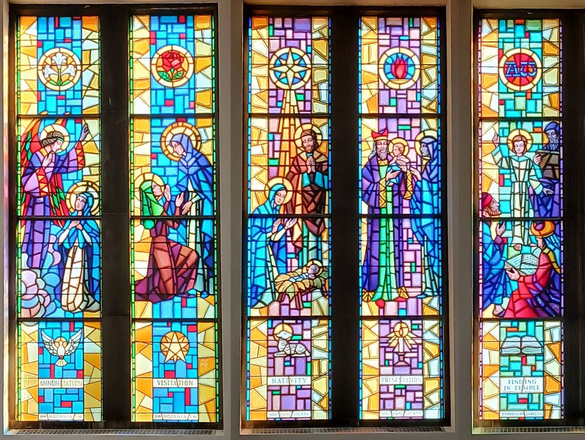 Stained glass windows along the nave